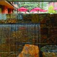 Exterior water feature at Aspen Square in the summer