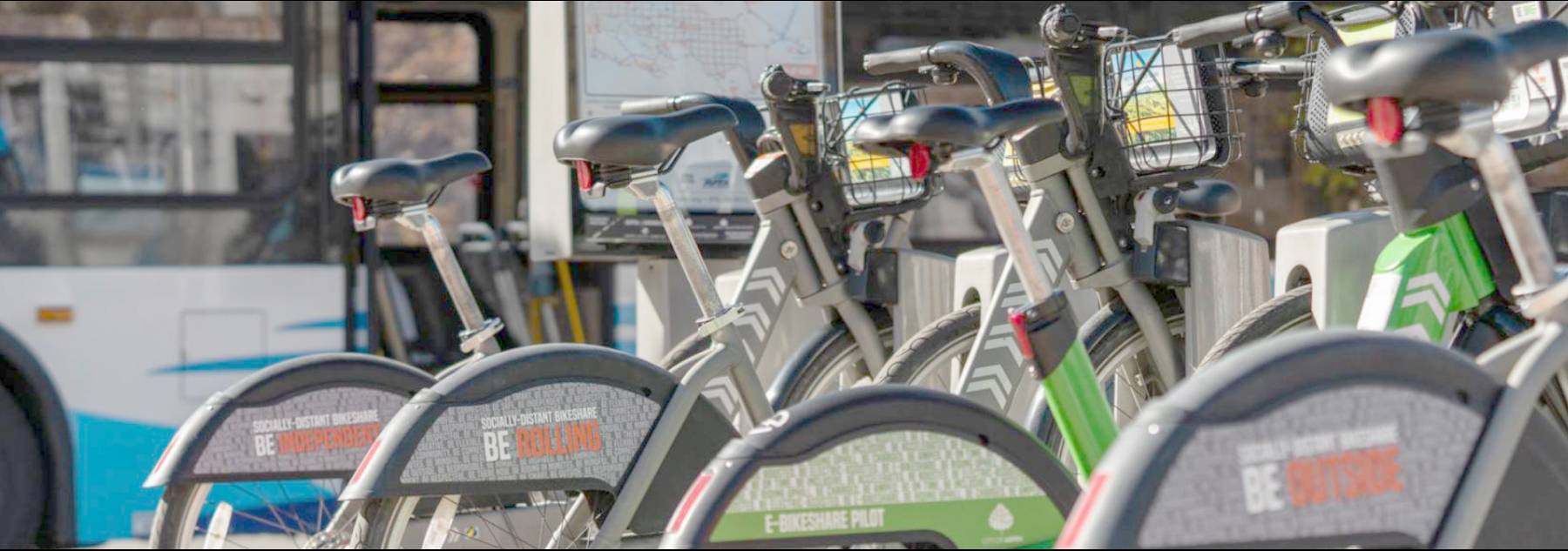 WE-cycle bikes and a RFTA bus