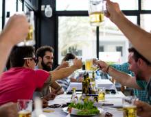 People cheersing at a restaurant